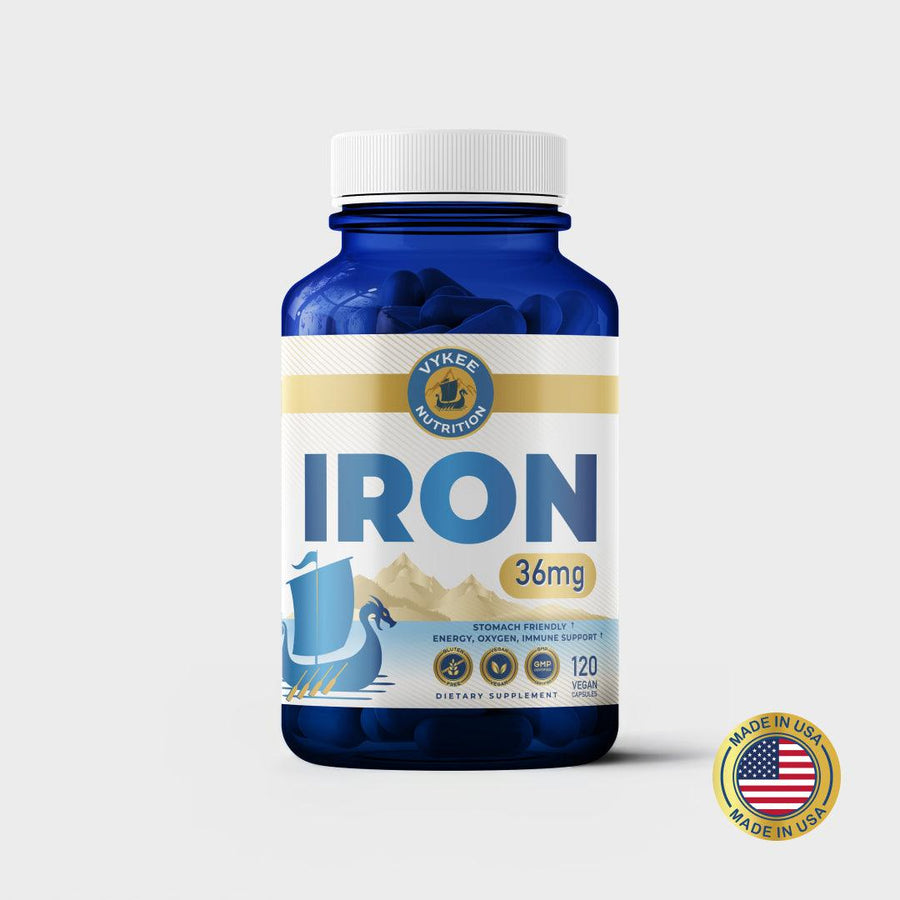 Iron Capsules bottle, navy glass with white and gold Vykee label